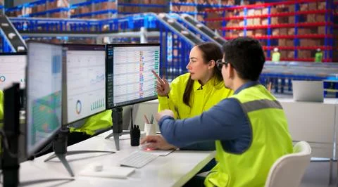 Business Manager Utilizes Computer For Intelligent Logistics In Warehouse Ope Stock Photos