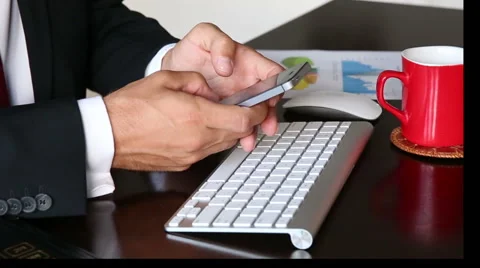 Business man's hand's texting on smartphone. Stock Footage 55544894