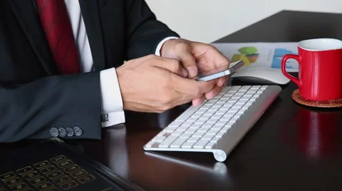 Business man's hand's texting on smartphone. Stock Footage 55545623