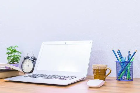 Business man's notebook computer is at the desk Stock Photos