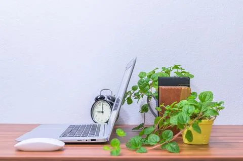 Business man's notebook computer is at the desk Stock Photos