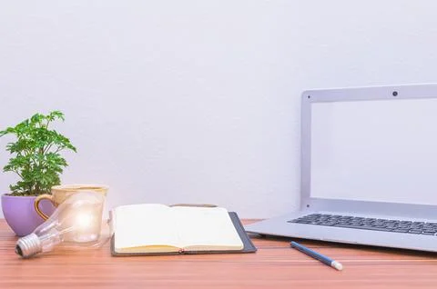 Business man's notebook computer is at the desk Stock Photos