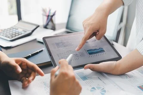 Business meeting, data analytics or women with graph presentation in office.. Stock Photos
