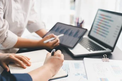 Business meeting, data analytics or women with graph presentation in office.. Stock Photos