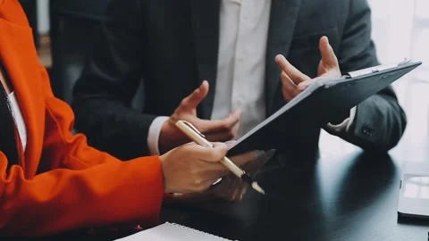 Business meeting with financial analysis using digital tablet and chart Stock Footage 325476746
