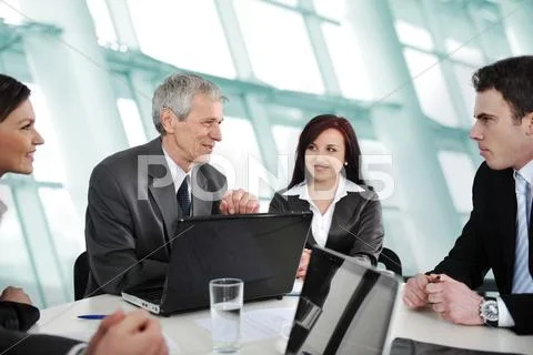 Business meeting - group of people in office at presentation Stock Photos