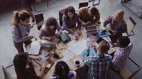 Business meeting at modern office. Top view of multiracial group of people Stock Footage