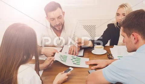 Business meeting. Young hipsters businessmen and women at modern Stock Photos