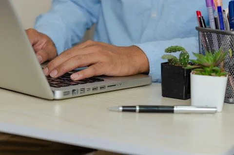 Business men are using computers to find information, the Internet, social .. Stock Photos
