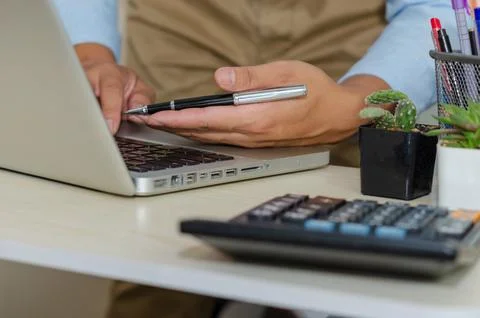 Business men are using computers to find information, the Internet, social .. Stock Photos