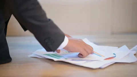 Business men check documents on the desk at the office Stock-Footage 137516348