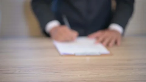 Business men check documents on the desk at the office Stock-Footage 137516377