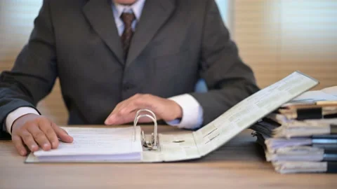 Business men check documents on the desk at the office Stock Footage 137516389