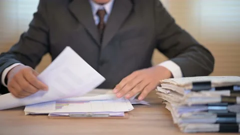 Business men check documents on the desk at the office Stock Footage 137516394