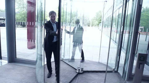 Business men entering office building Stock Footage 59396914