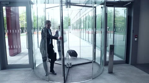 Business men entering office building Stock Footage 59397112