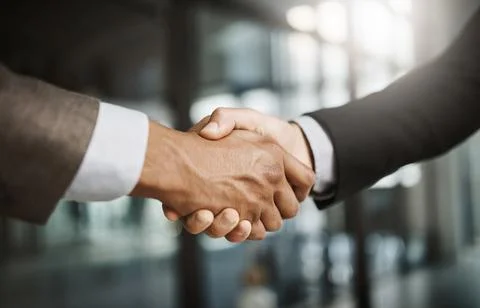 Business men in handshake hand showing success, support and trust through sign Stock Photos