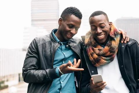 Business men using mobile in the Street. Stock Photos