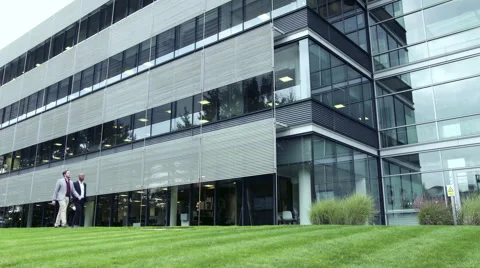 Business men walking in lawn Stock Footage 59396339