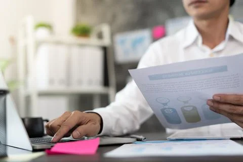 Business men work with computers to plan the production of goods. Business pe Foto stock
