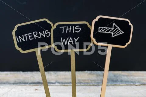 Business message INTERNS THIS WAY Stock Photos