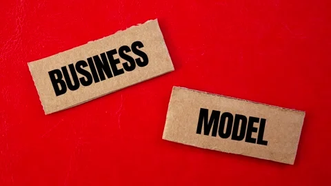 Business model message writing on ripped torn cardboard paper pieces Video stock 287021211