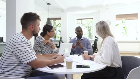 Business multi-ethnic team working together in a meeting. Video stock 233696366