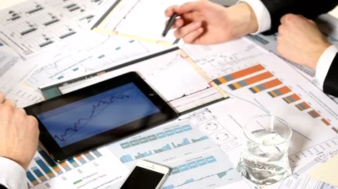 Business negotiations: a tablet with graphs on the table, developing a business Stock Footage 49153756