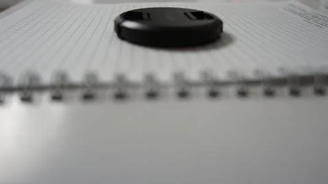 Business notepad, notepad, notebook, lens cap on notepad Stockfoto's