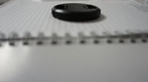 Business notepad, notepad, notebook, lens cap on notepad Stock Photos