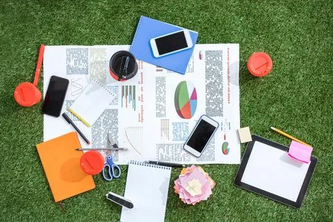 Business objects laying on green Stock Photos