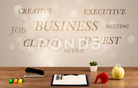 Business office desk with writing on wall Stock Photos
