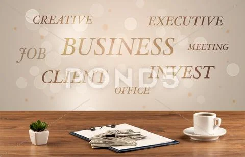 Business office desk with writing on wall Stock Photos