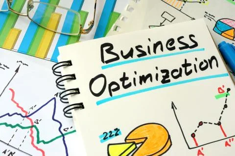 Business Optimization written on a notepad sheet. Stock Photos