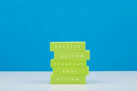 Business or personal development concept. Stack of green tablets with text Stock Photos