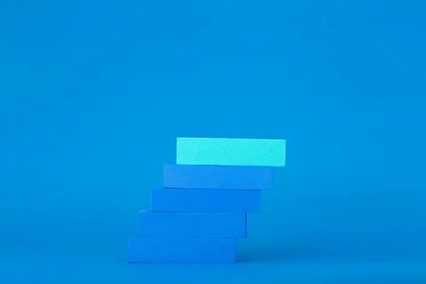 Business or personal development concept. Ladder to success made of blue tablets Stock Photos