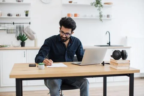 Business owner correcting text using computer at home Stockfoto's