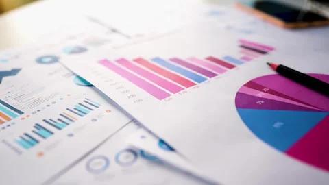 Business papers graph chart report laptop pencil view Stock Footage 293515626