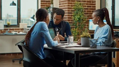 Business partners creating presentation Stock Photos