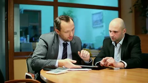 Business partners with digital tablet in the office, steadicam shot Stock Footage