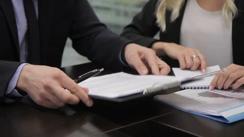 Business partners discuss contract at table in international company. Video stock 86458800