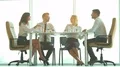 The business partners discuss at the table 4k or 4k+ Resolution