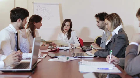 Business partners discussing documents and ideas at meeting Stock Footage 33359734