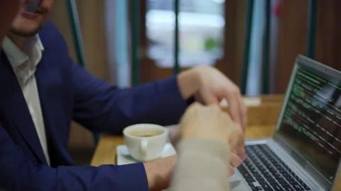 Business partners discussing programming code Stock Footage 142390194