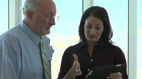 Business partners on ipad / tablet computer Vídeo Stock 12714098