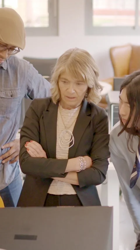 Business partners looking at the same computer in a coworking Video stock 265025534