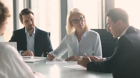 Business partners negotiate sign contract handshake at group meeting Stock Footage