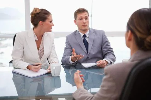 Business partners talking with lawyer Stock Photos