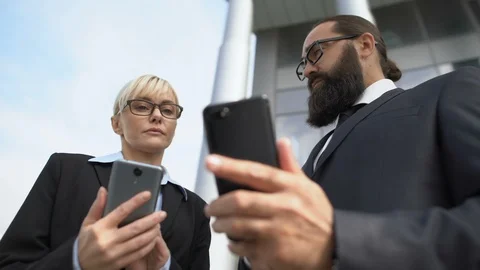 Business partners using gadgets to discuss and agree project, modern technology Stock-Footage 117377446