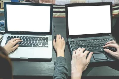 Business partners working together on the same desk, they are using a lapto.. Foto stock